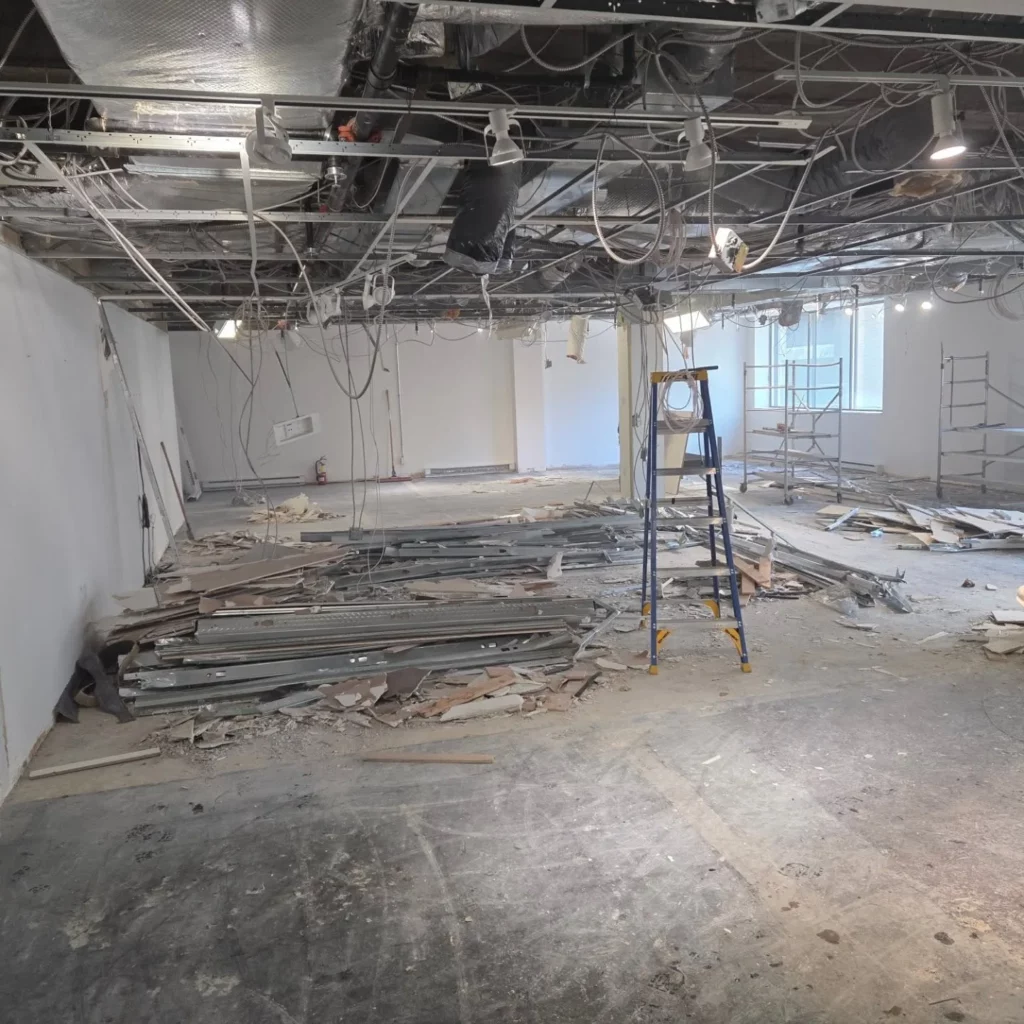 Office floor at 2100 Drummond stripped to the ceiling before the electrical work