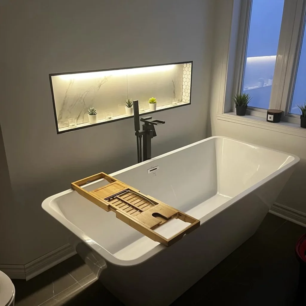 Renovated bathroom with an LED-lit bathtub niche