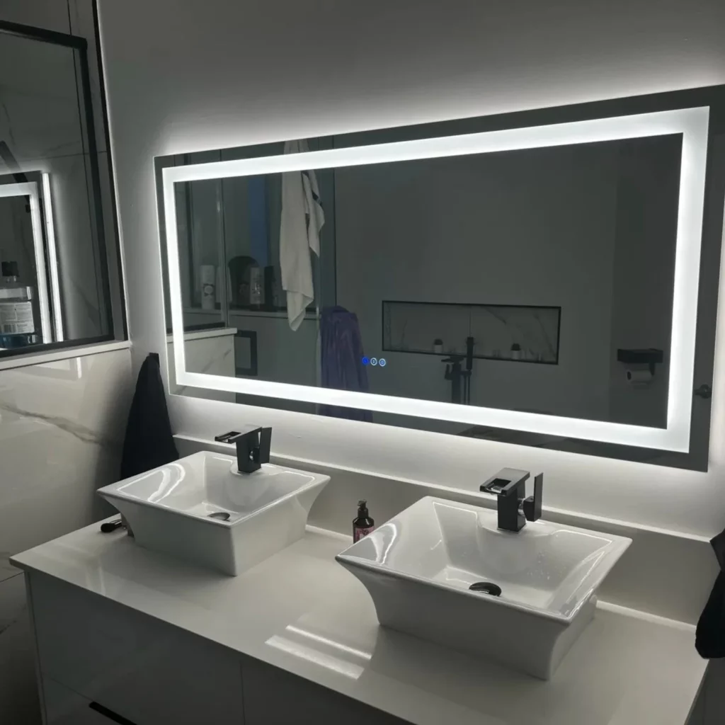 Bathroom vanity with a backlit LED mirror