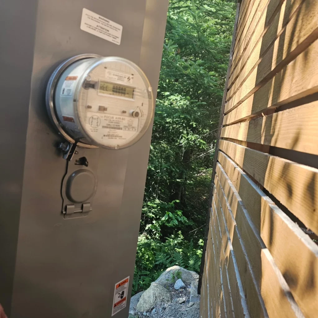 New 320 A meter base installed on a chalet wall