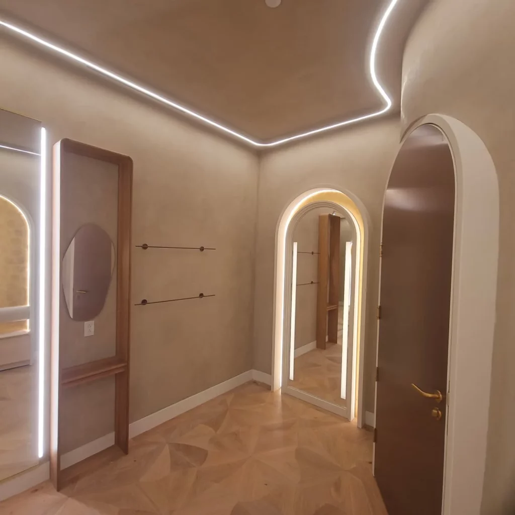 Arched doorway outlined with LED strip lighting in the Dynamite St-Bruno store