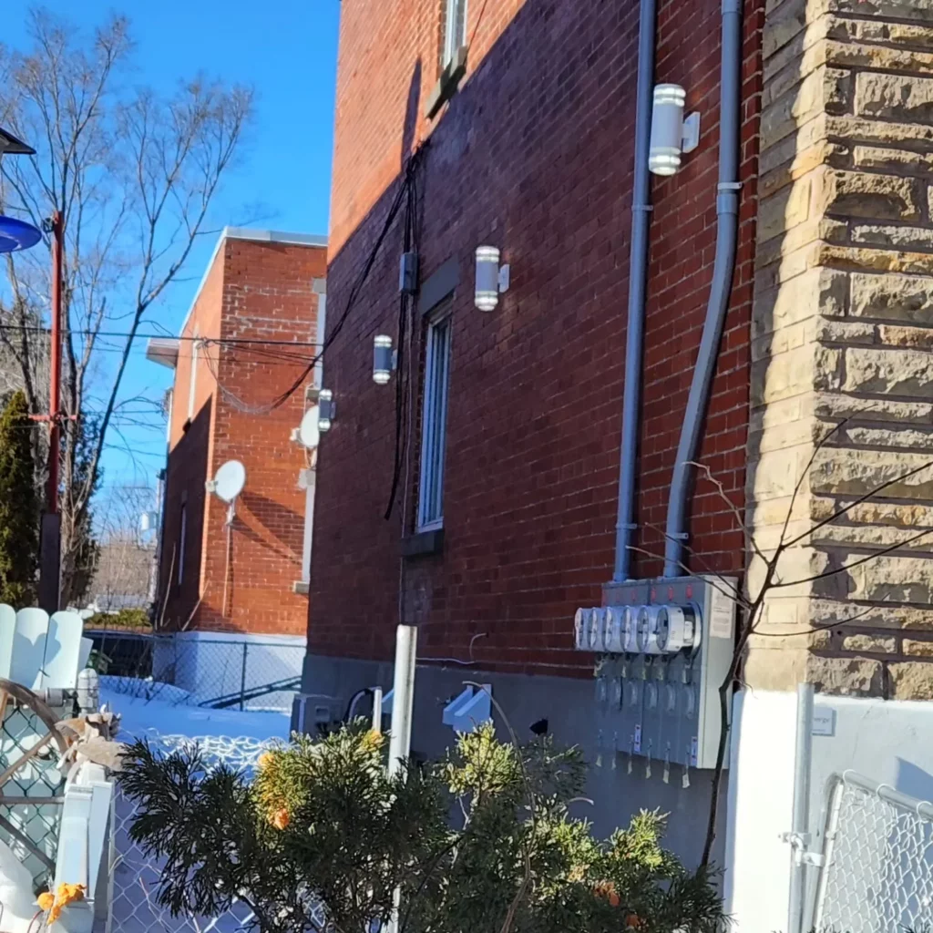 Exterior wall lights on a brick home